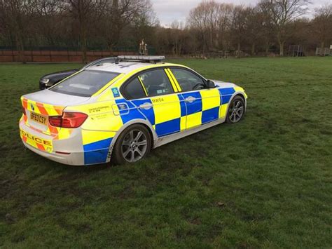 car mud cleaner|police car stuck in mud.